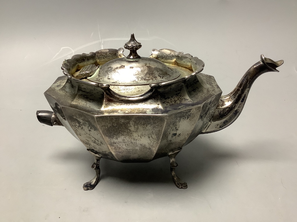 A late Victorian small silver teapot, of oval twelve-sided form approximately gross 11oz